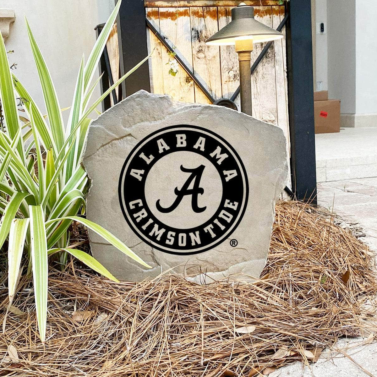 University of Alabama outdoor logo marker crafted from durable concrete, creating a timeless landscape feature for loyal Crimson Tide fans.