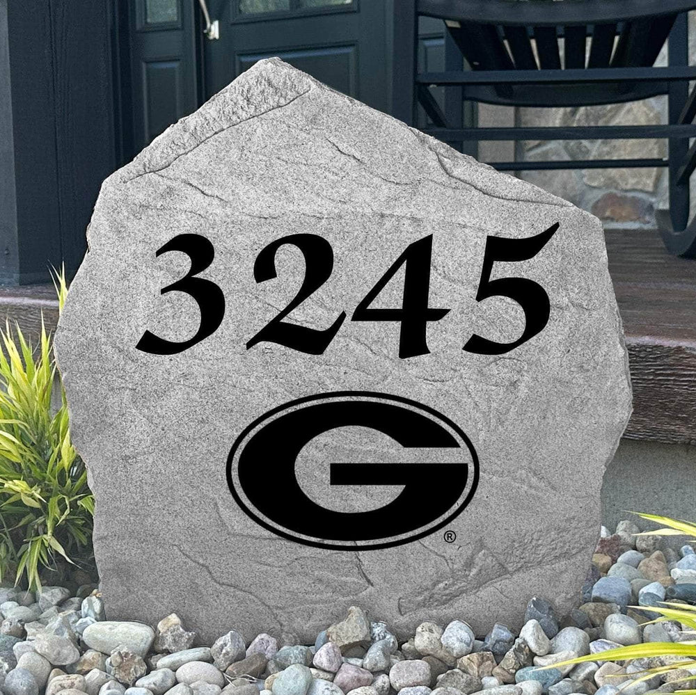 Custom University of Georgia Address Stone displayed in a landscaped flower bed with personalized house numbers and officially licensed Georgia Bulldogs artwork. This engraved address marker creates a striking focal point for alumni homes and devoted Bulldogs fans.