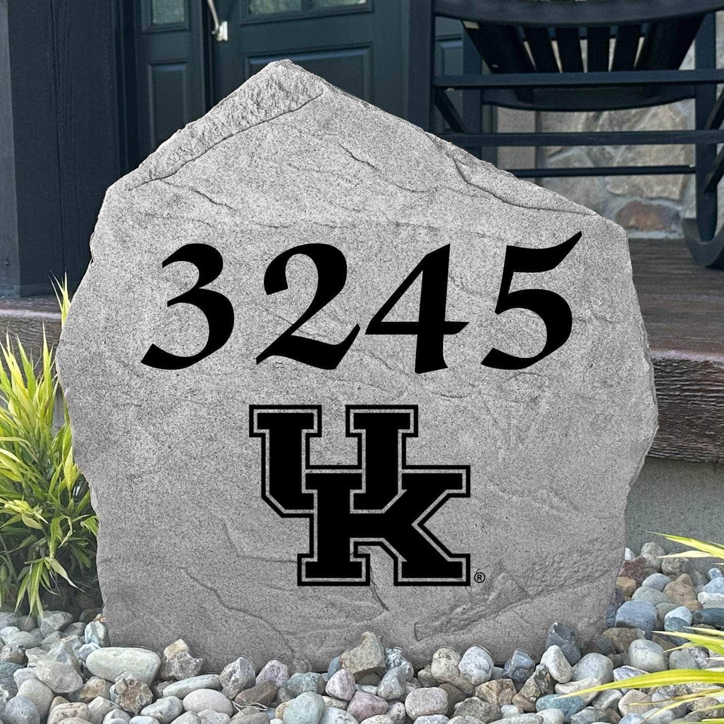 Custom University of Kentucky Address Stone displayed in a landscaped flower bed with personalized house numbers and officially licensed Kentucky Wildcats artwork. This engraved address marker creates a striking focal point for alumni homes and devoted Wildcats fans.
