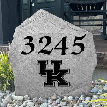 Custom University of Kentucky Address Stone displayed in a landscaped flower bed with personalized house numbers and officially licensed Kentucky Wildcats artwork. This engraved address marker creates a striking focal point for alumni homes and devoted Wildcats fans.