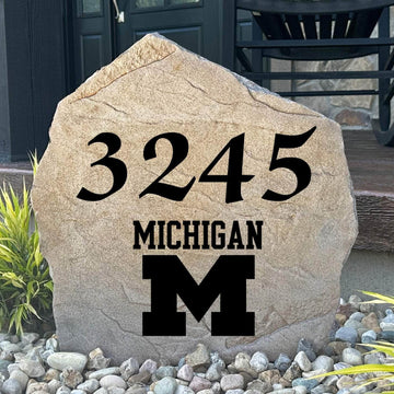 Officially licensed University of Michigan Address Stone featuring custom house numbers and the iconic Michigan Wolverines logo engraved directly into the stone surface. This personalized address marker adds school pride and curb appeal to front yards, gardens, driveways, and entryways.