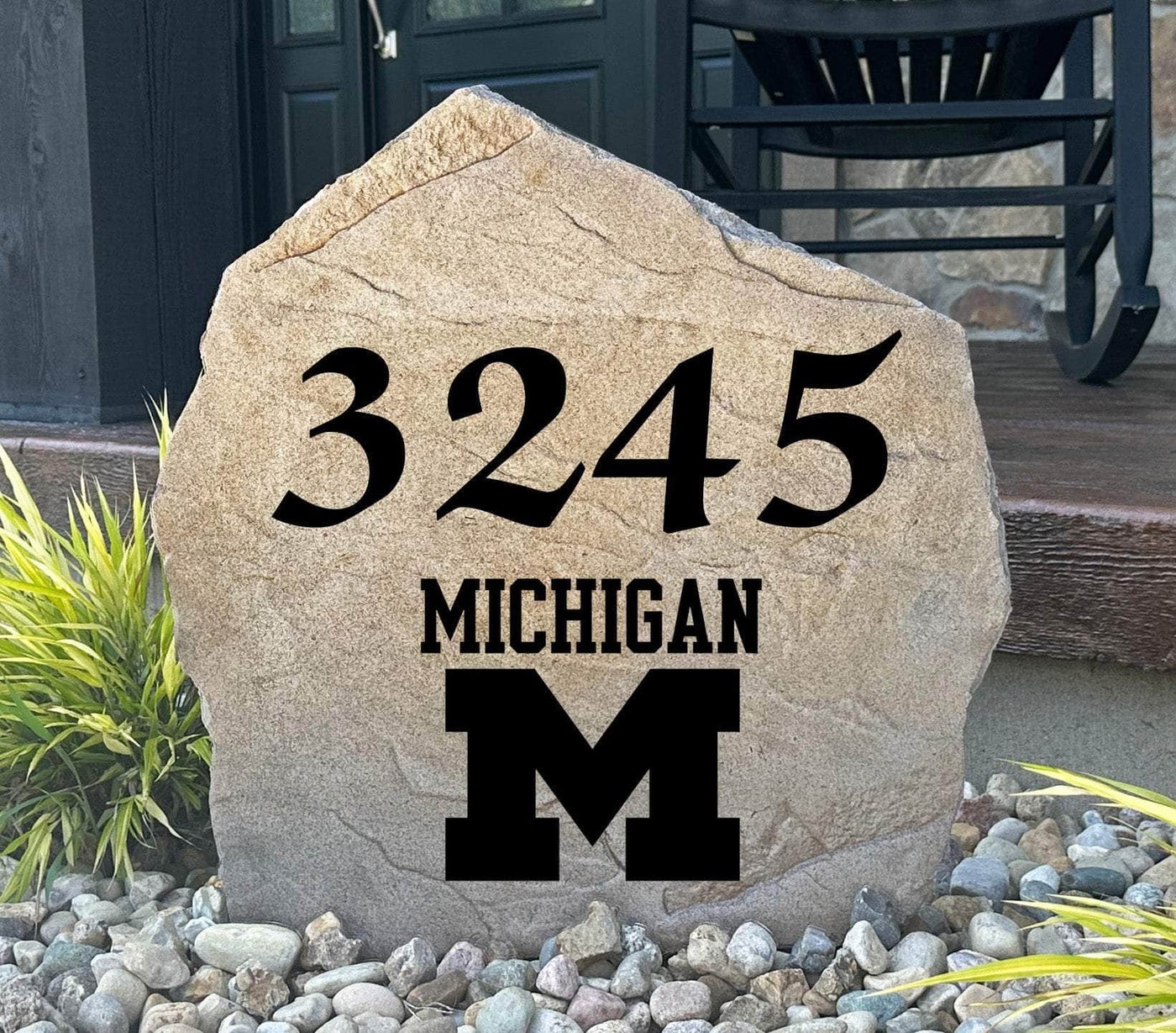 University of Michigan address stone with bold house numbers and official college logo.