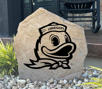 University of Oregon stone featuring engraved Duck mascot logo, perfect for fans.