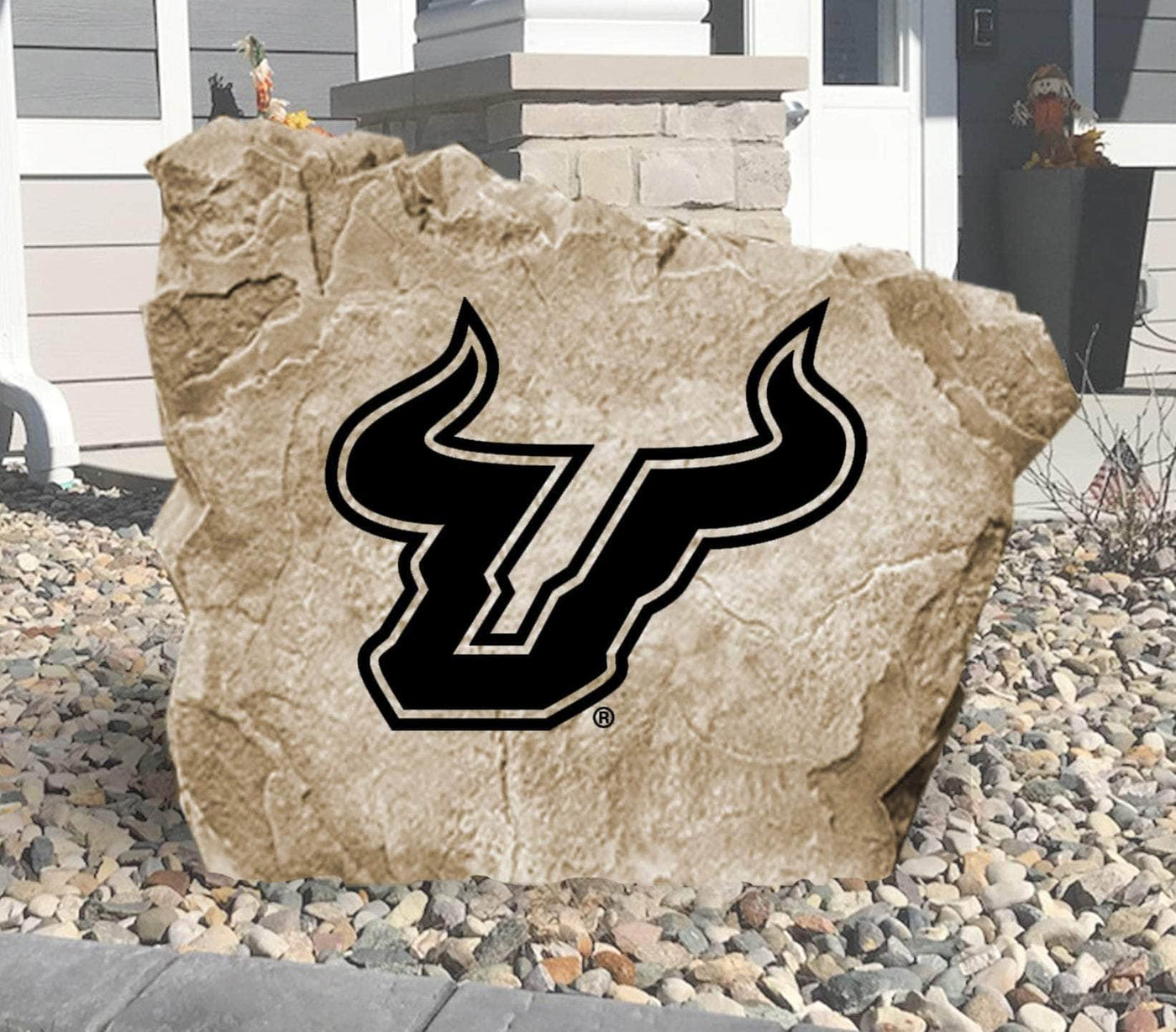 Engraved University of South Florida Bulls logo on decorative landscaping stone