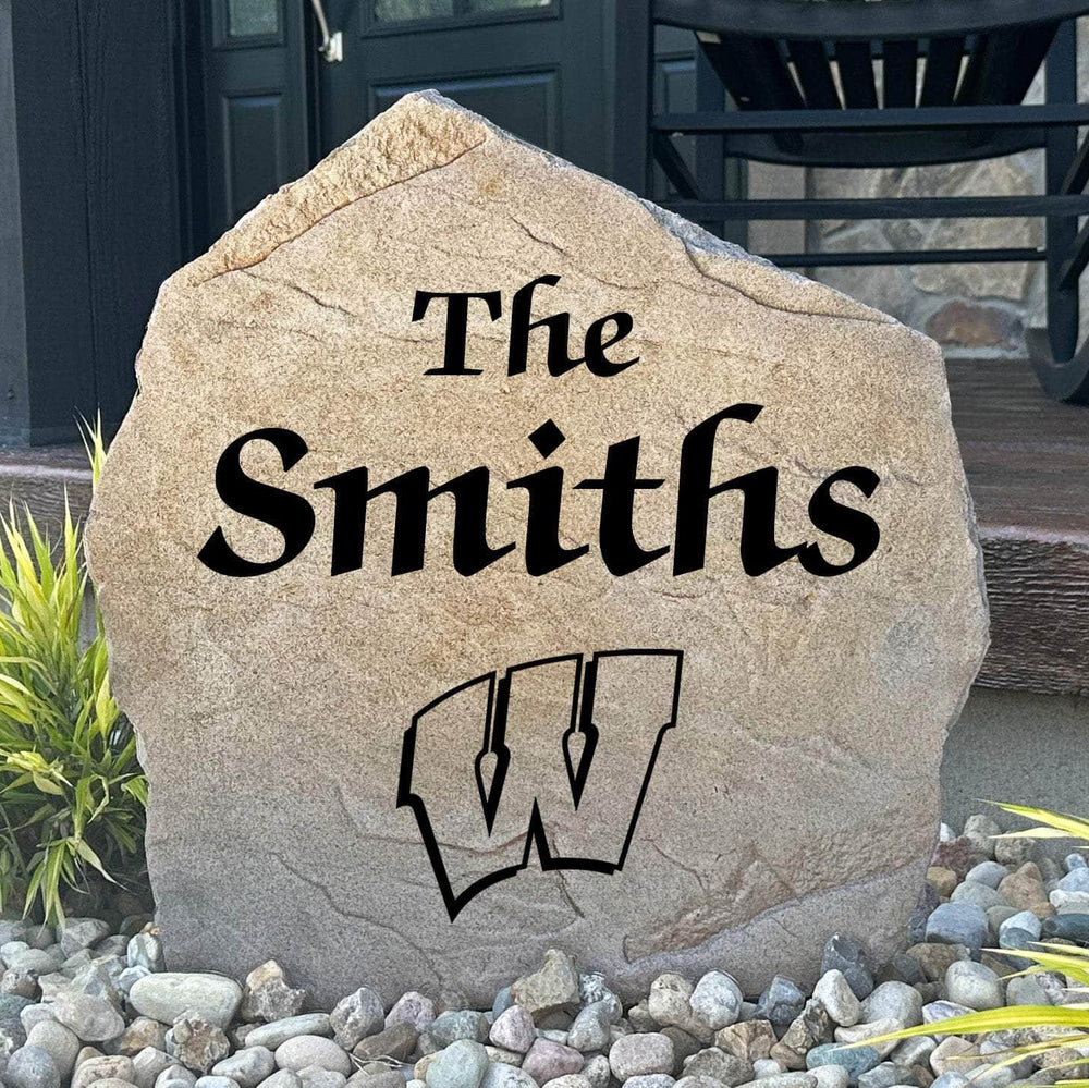 Officially licensed University of Wisconsin Name Stone featuring a personalized family name and the iconic Wisconsin Badgers logo engraved directly into the stone surface. This custom engraved garden stone adds school pride and curb appeal to front yards, patios, gardens, and entryways.