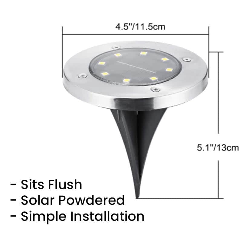 Energy-efficient LED landscape spotlight powered by the sun, creating beautiful nighttime illumination for custom stone décor and residential landscapes year-round.