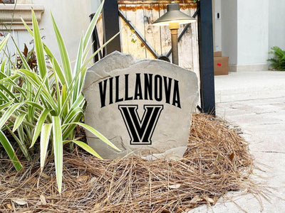 Outdoor landscaping rock featuring engraved Villanova logo