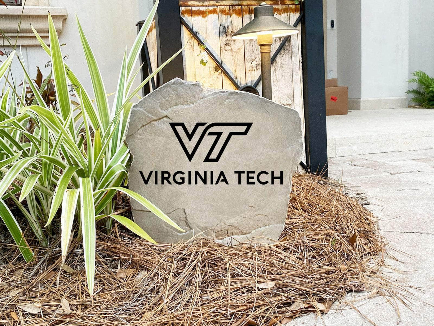 Outdoor engraved stone featuring Virginia Tech Hokies emblem