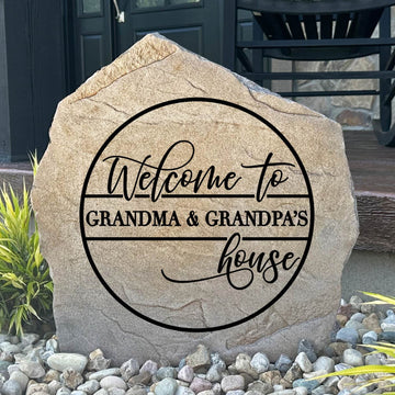 Personalized Grandma & Grandpa's House Stone featuring a heartwarming design engraved directly into the stone surface. This decorative garden stone creates a warm and welcoming entrance for grandparents' homes, front yards, patios, and entryways.