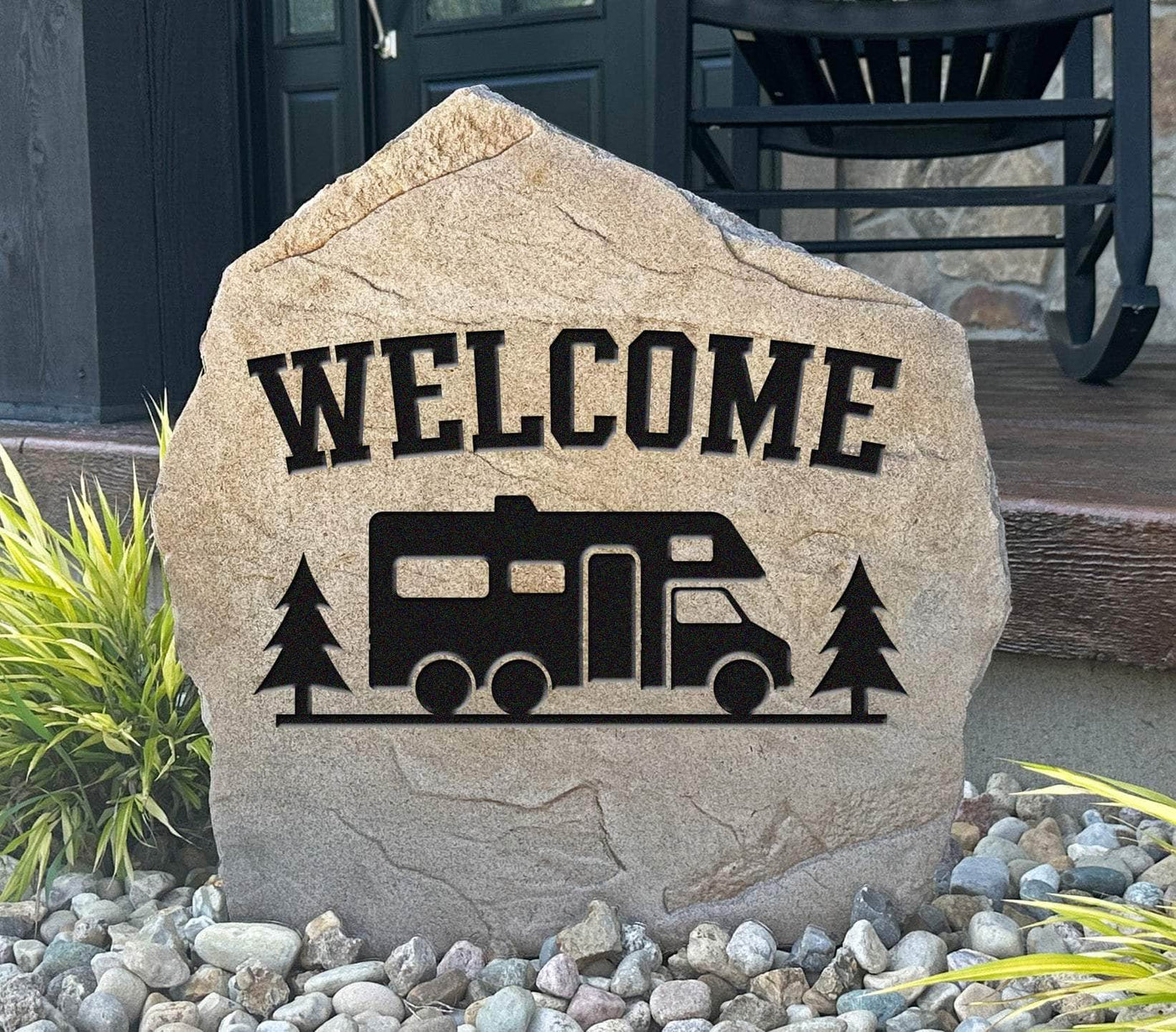 Engraved stone with RV and trees reading "Welcome" – outdoor yard décor.