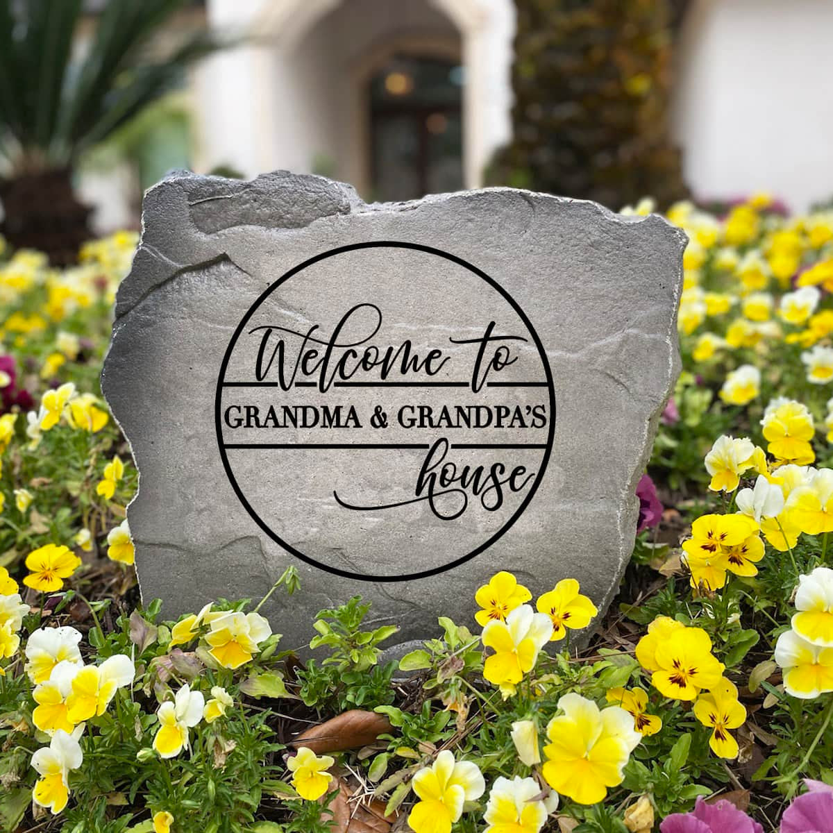 Custom engraved Grandma & Grandpa's House Stone creating a beautiful and inviting accent for the landscape. This decorative garden stone adds lasting charm and curb appeal while celebrating cherished family memories.