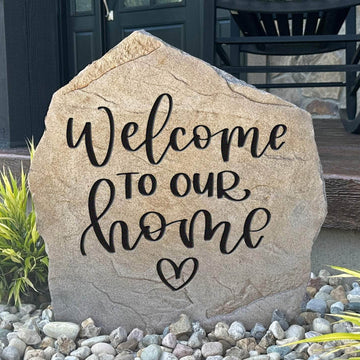 Welcome To Our Home Heart engraved stone featuring a graceful heart design that creates a warm and inviting entrance to your home's landscape.