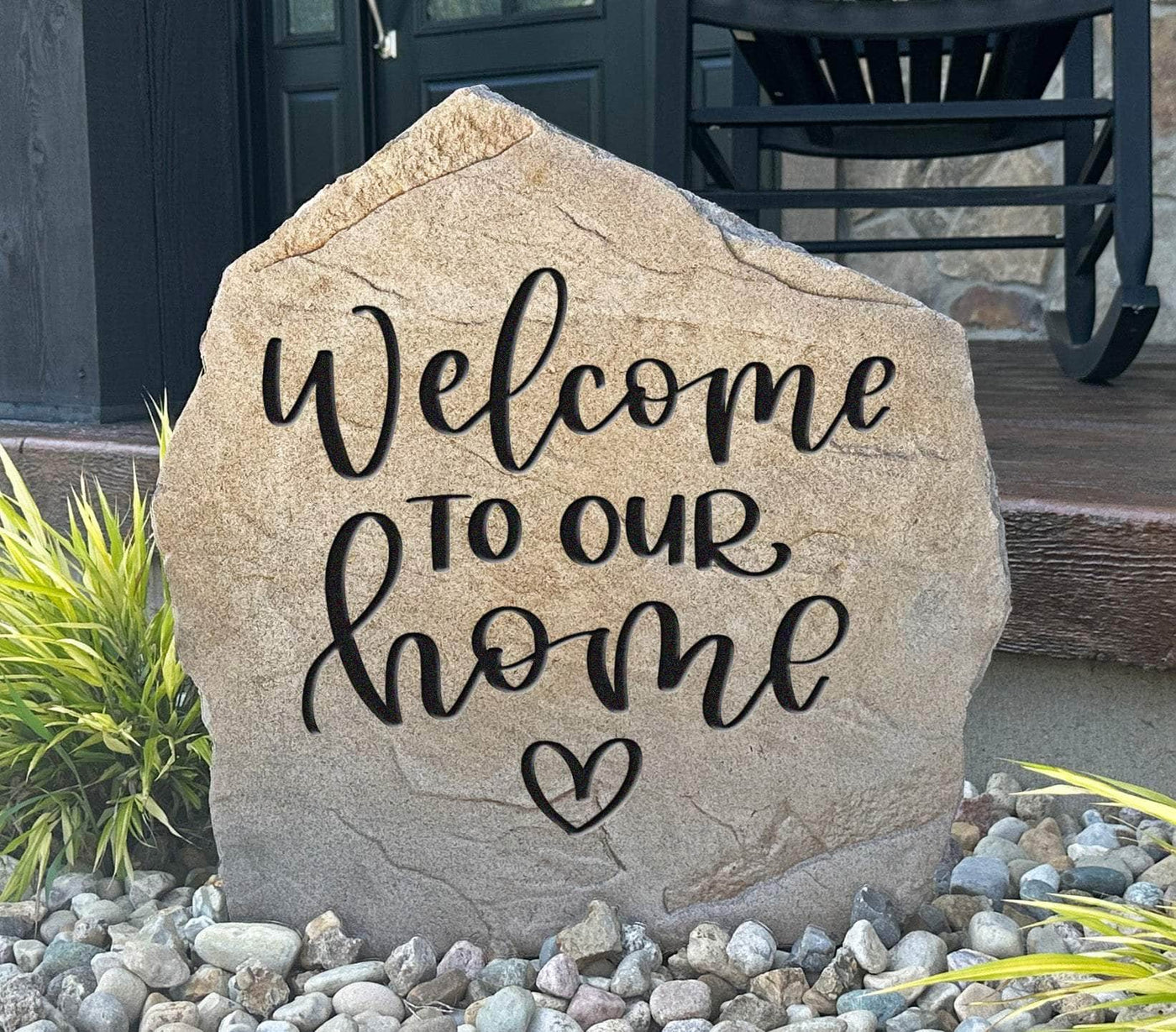 Welcome to Our Home engraved stone with heart design for front porch decor.