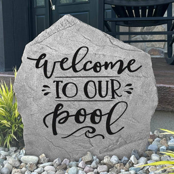 Welcome To Our Pool engraved stone creating a stylish greeting for guests while enhancing pool decks, patios, and backyard entertaining spaces.
