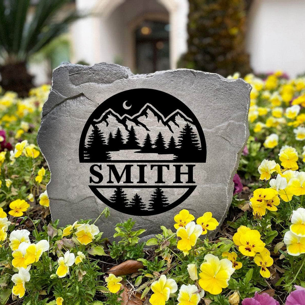 Personalized Forest Monogram Stone handcrafted in the USA with elegant woodland artwork and custom engraving. This decorative garden stone enhances landscape beds, patios, and front yard entrances with natural beauty.