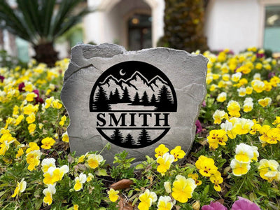 Mountain and pine tree stone with engraved family name, great gift for nature lovers.