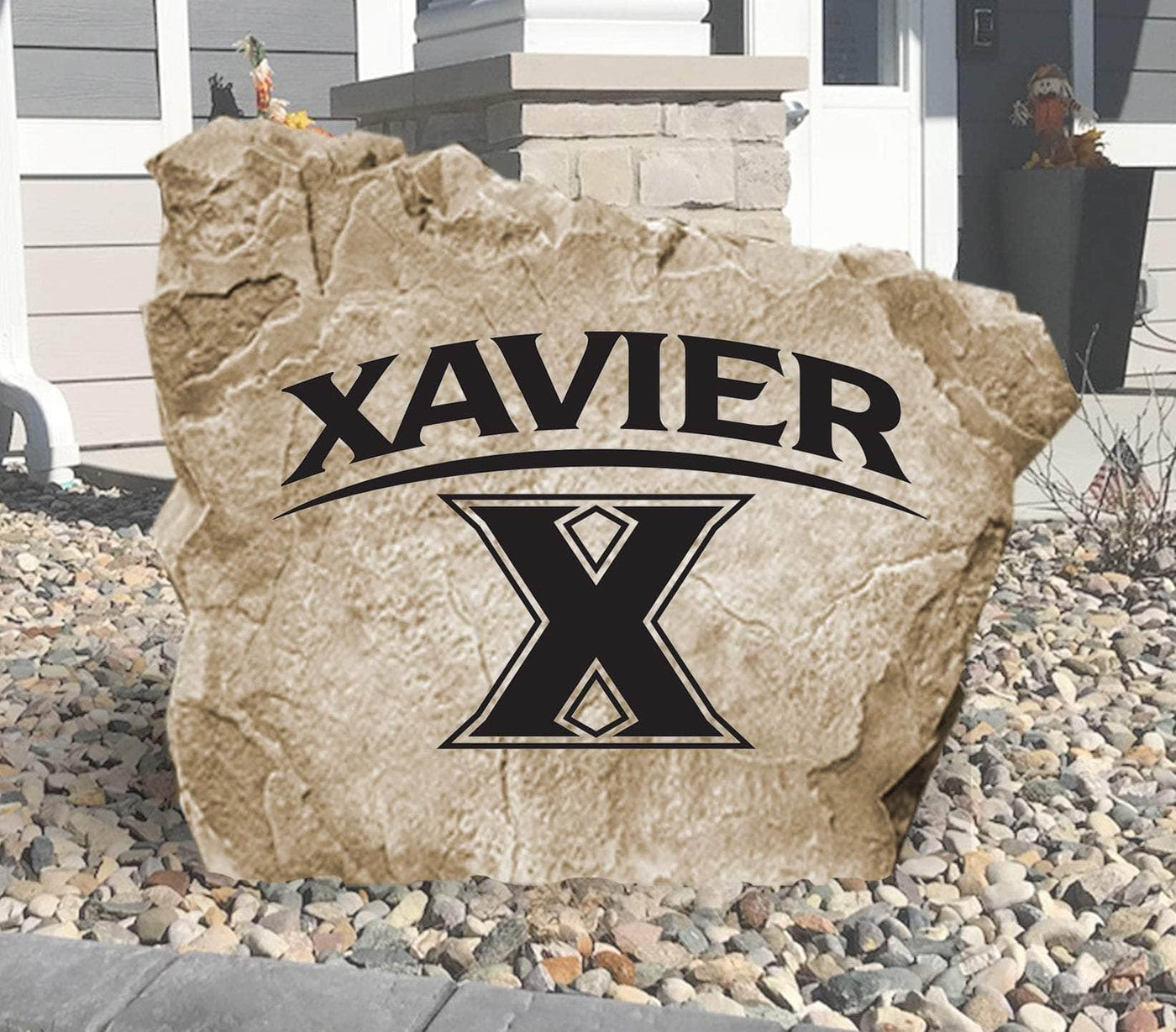 Engraved Xavier University logo stone for outdoor landscaping