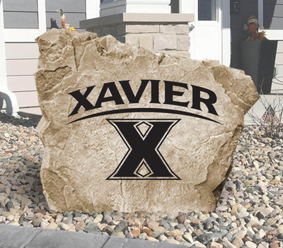 Engraved Xavier University logo stone for outdoor landscaping