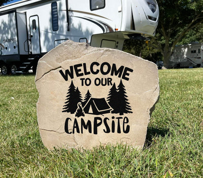 Custom engraved stone reading welcome to our campsite