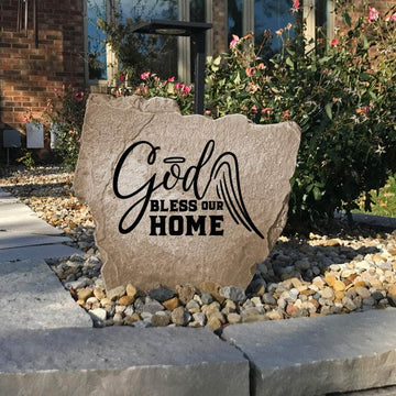 Faith-filled landscape stone featuring the message "God Bless Our Home," designed to bring hope, peace, and warmth to your outdoor living space.