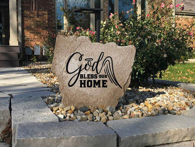 Rustic decorative rock engraved with God Bless Our Home message