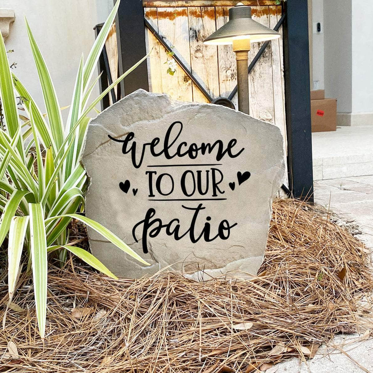 Outdoor patio landscape stone featuring the message "Welcome To Our Patio," perfect for creating a cozy and inviting gathering place.