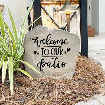 Outdoor patio landscape stone featuring the message "Welcome To Our Patio," perfect for creating a cozy and inviting gathering place.