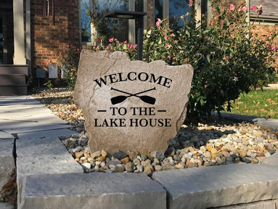 Rustic engraved stone with Welcome to the Lake House design