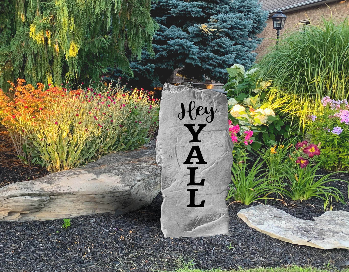 Country style front porch welcome stone saying Hey Y’all
