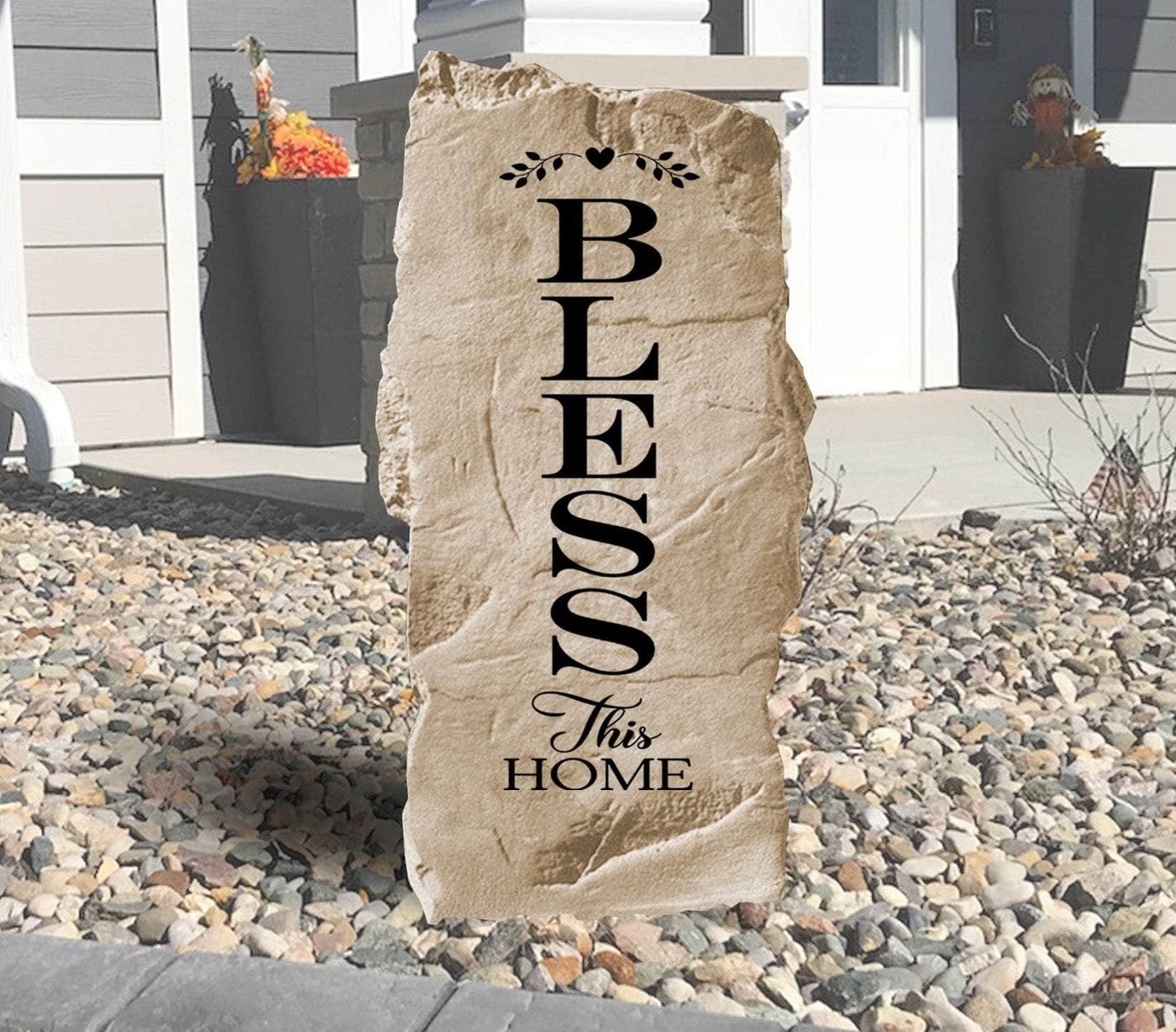 Decorative landscaping stone featuring Bless This Home message