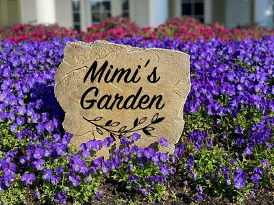 Custom name stone for garden decor featuring elegant script and leaf accents.