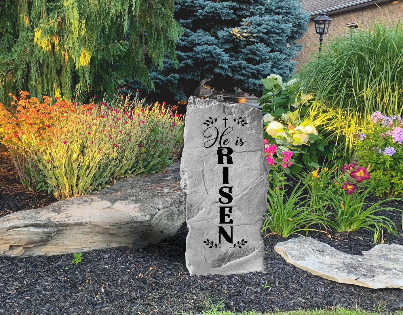 Outdoor decorative stone with engraved He Is Risen design