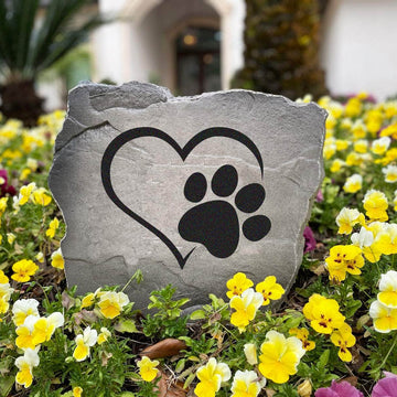 Pet-inspired outdoor stone featuring a heart and paw print design, perfect for gardens, walkways, patios, and backyard retreats.