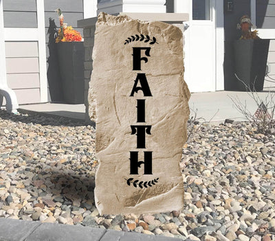 Engraved stone featuring the word Faith for home or garden