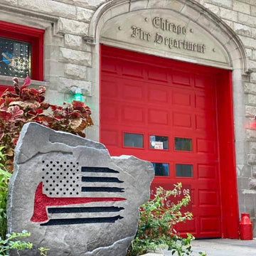 Weather-resistant firefighter tribute monument featuring an American flag design, perfect for homes, memorial gardens, and fire service families.