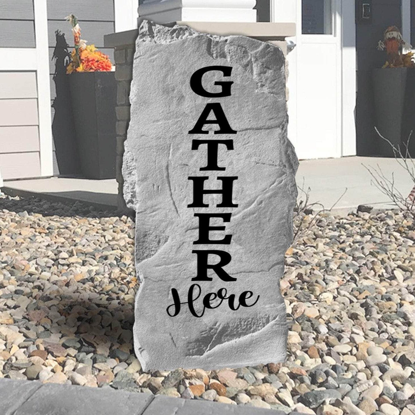 Gather Here engraved landscape stone inviting family and friends to enjoy meaningful moments in beautifully designed outdoor living spaces.