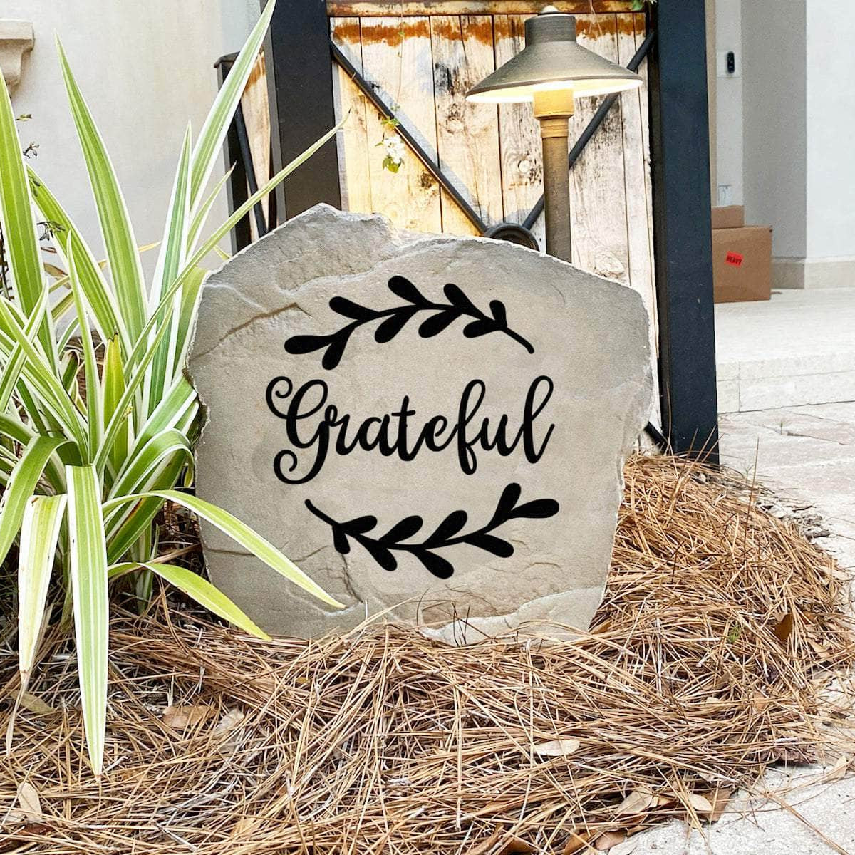 Decorative gratitude garden stone featuring the word "Grateful," perfect for enhancing walkways, entryways, and relaxing backyard retreats.