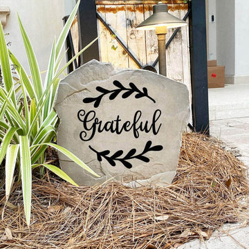 Decorative gratitude garden stone featuring the word "Grateful," perfect for enhancing walkways, entryways, and relaxing backyard retreats.