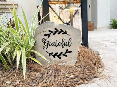 Outdoor engraved stone with grateful word design