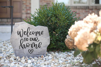 Engraved heart-shaped Welcome to Our Home stone gift idea.