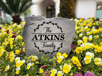 Family name garden stone with engraved vine circle pattern