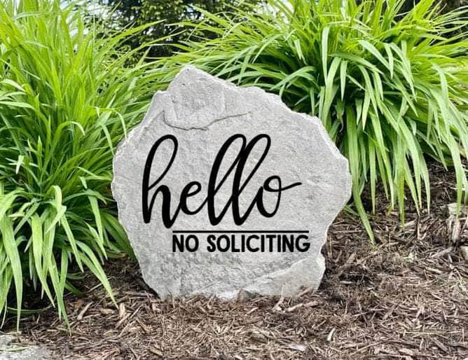 Outdoor landscaping stone with engraved No Soliciting message