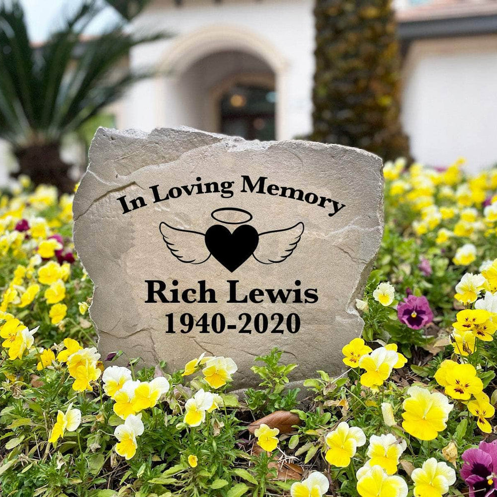 Elegant memorial landscape stone featuring angel wings embracing a heart, offering a meaningful expression of love that lives on forever.