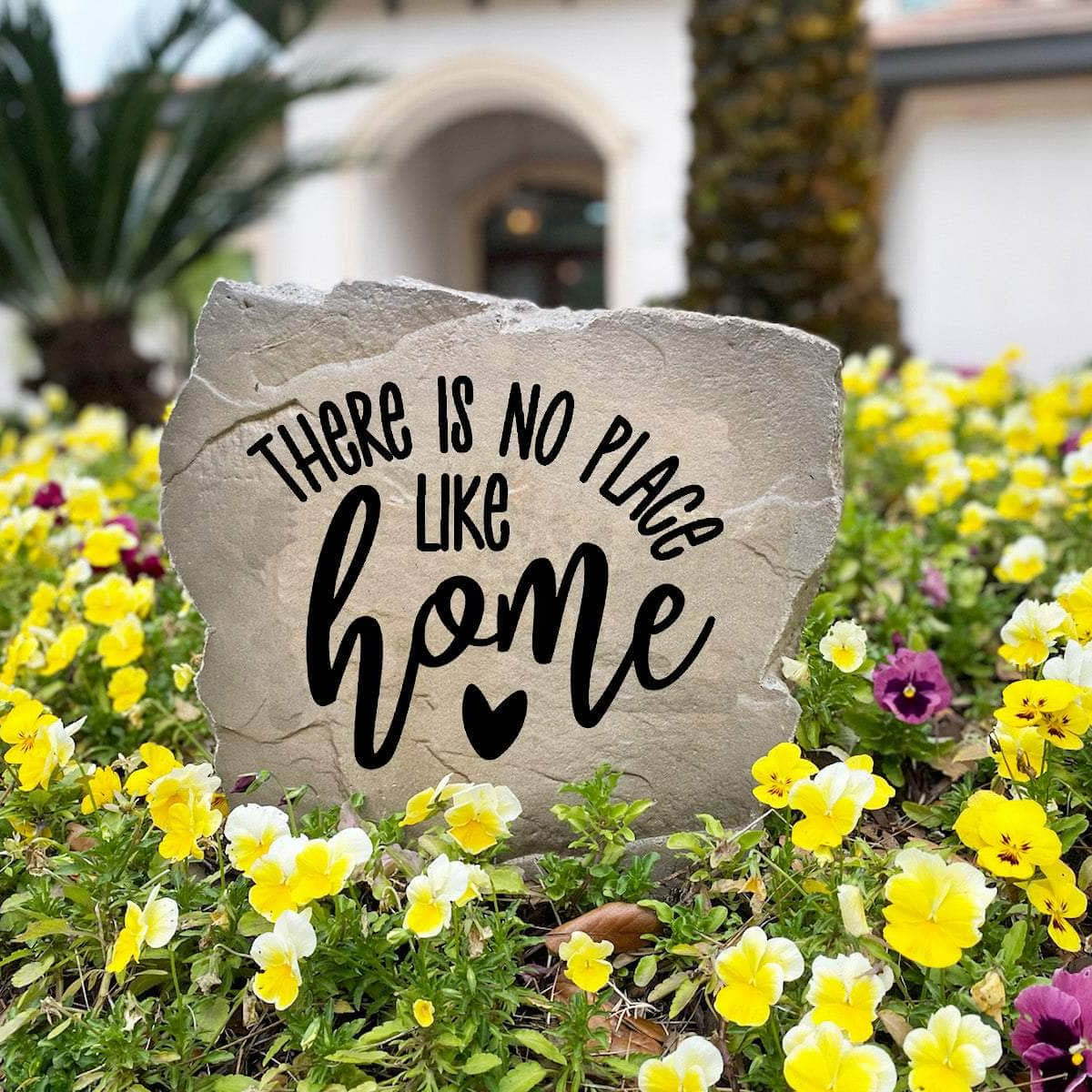 Weather-resistant welcome stone featuring the heartfelt phrase "There Is No Place Like Home," perfect for enhancing curb appeal with meaningful outdoor décor.