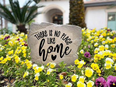 Personalized garden rock engraved with “There is no place like home.”