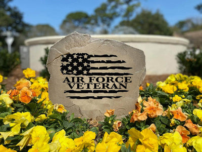 Outdoor decorative rock featuring veteran flag memorial engraving