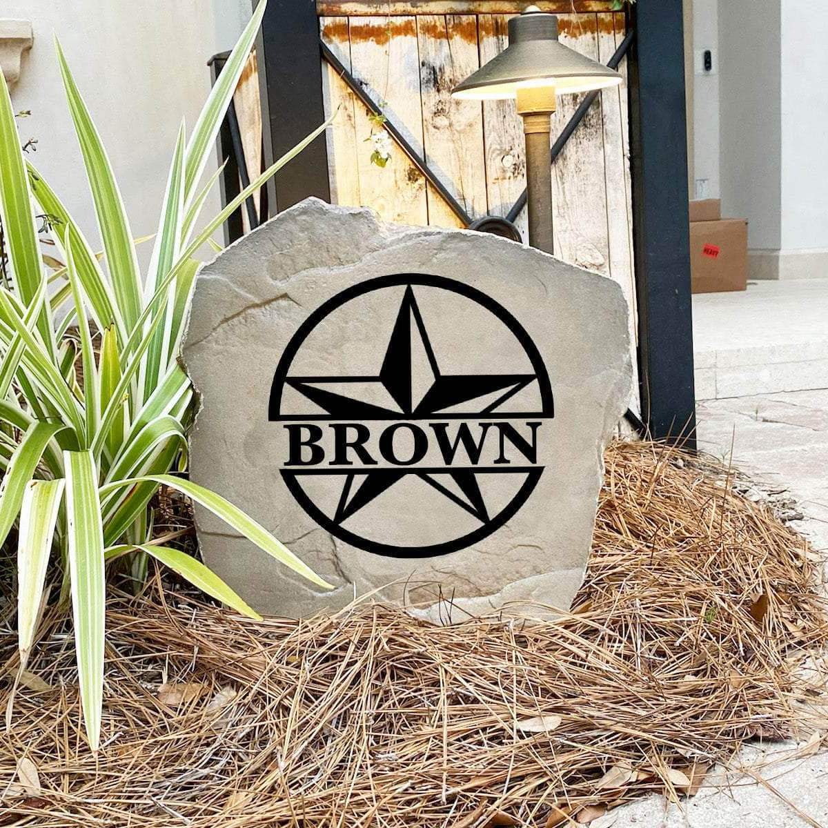 Decorative monogram landscape stone featuring a classic star design, perfect for enhancing flower beds, patios, walkways, and home entrances.
