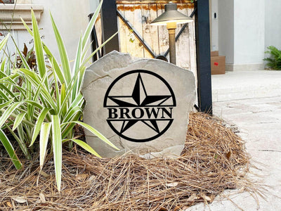 Custom star monogram engraved stone featuring bold circular design.