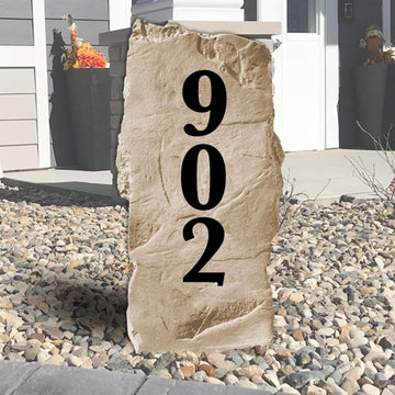 Vertical address number stone personalized with custom house numbers, creating a modern and easy-to-read entrance for your home's landscape.