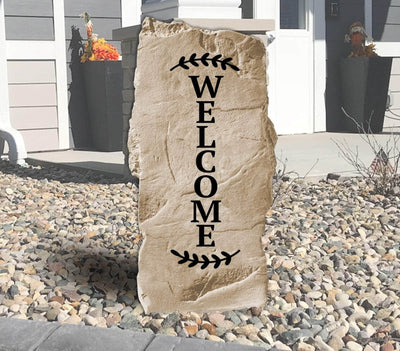 Vertical engraved stone featuring the word Welcome for home entryway